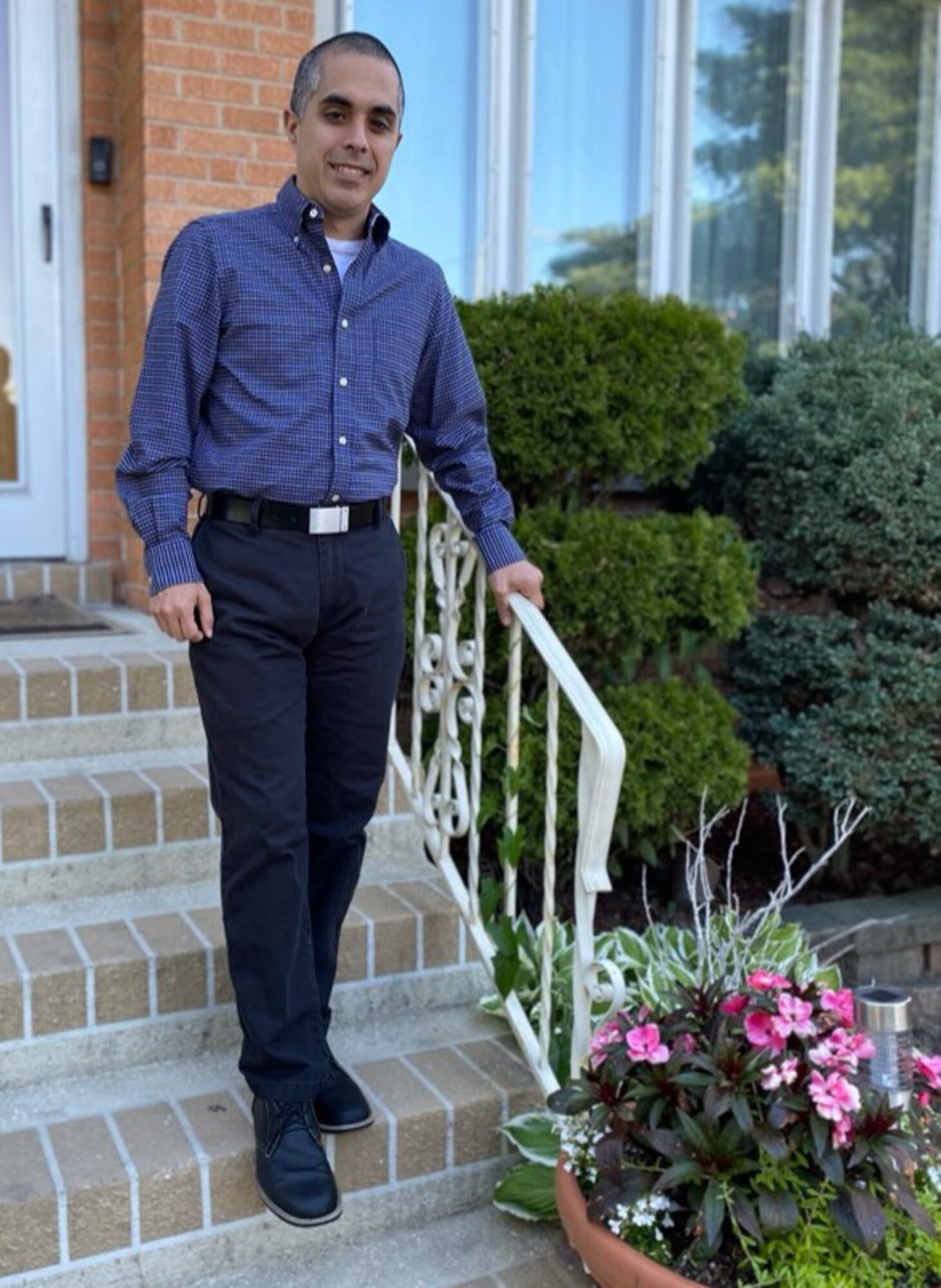 Tech. Sgt. Brandon Ibanez, a cyber intelligence analyst with the 854th Combat Operations Squadron, stands for a photo outside his home in Chicago, Illinois, June 15, 2020. In his civilian career, he works for a biopharmaceutical company that develops and manufactures a variety of therapies for patients. (Courtesy photo by Anna Czekaj)