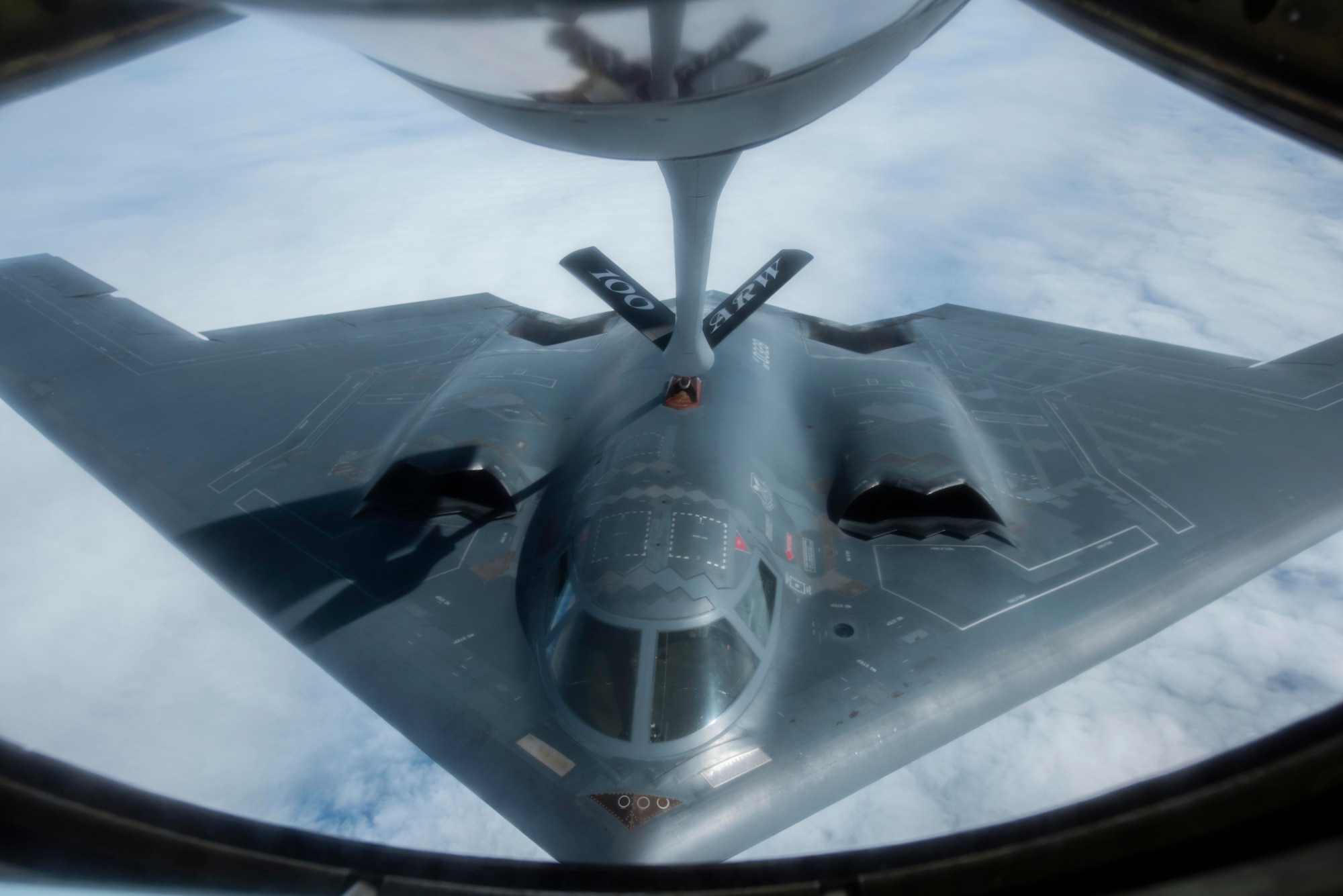 A B-2 Spirit assigned to the 509th Bomb Wing at Whiteman Air Force Base, Missouri, receives fuel from a KC-135 Stratotanker assigned to the 100th Air Refueling Wing at RAF Mildenhall, England, over the North Sea June 18, 2020. The aerial refueling was conducted in support of a strategic bomber mission north of the Arctic Circle. (U.S. Air Force photo by Airman 1st Class Joseph Barron)