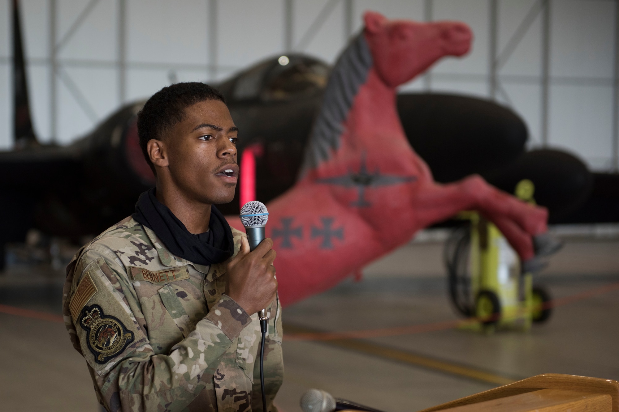 U.S. Air Force Senior Airman Clarence Bennett, 99th Expeditionary Reconnaissance Squadron non-destructive inspections journeyman, sings the national anthem during a change of command ceremony, at RAF Fairford, England, June 24, 2020. The change of command ceremony is a military tradition that represents a formal transfer of a unit’s authority and responsibility from one commander to another. (U.S. Air Force photo by Airman 1st Class Jennifer Zima)