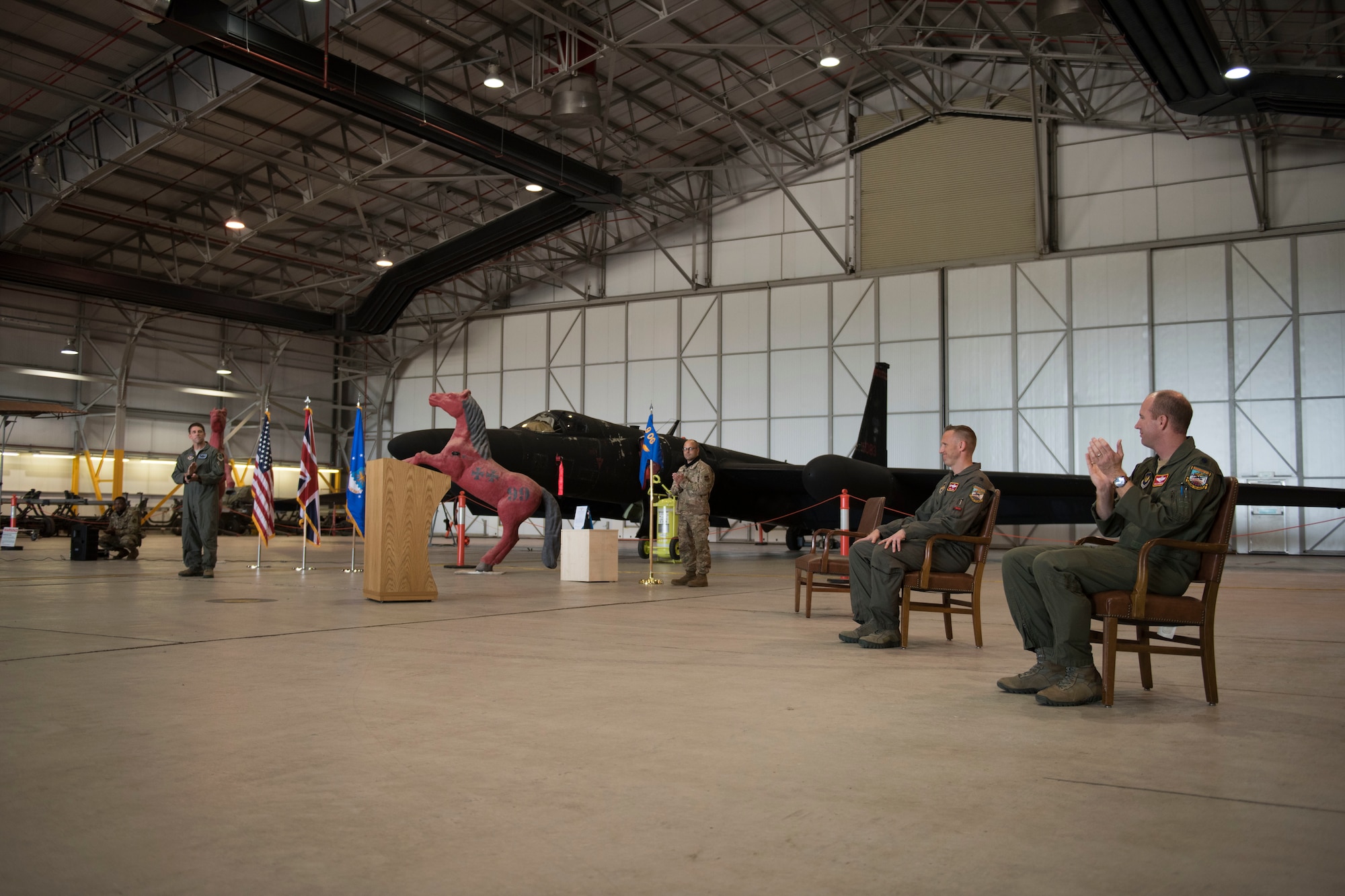 U.S. Air Force Lt. Col. Peter Gryn, outgoing 99th Expeditionary Reconnaissance Squadron commander, receives applause for receiving The Meritorious Service Medal award during a change of command ceremony, at RAF Fairford, England, June 24, 2020. The change of command ceremony is a military tradition that represents a formal transfer of a unit’s authority and responsibility from one commander to another. (U.S. Air Force photo by Airman 1st Class Jennifer Zima)