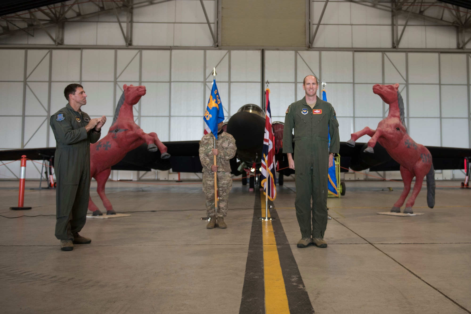 U.S. Air Force Lt. Col. Brian Staniszewski, assumes command of the 99th Expeditionary Reconnaissance Squadron, during a change of command ceremony, at RAF Fairford, England, June 24, 2020. The change of command ceremony is a military tradition that represents a formal transfer of a unit’s authority and responsibility from one commander to another. (U.S. Air Force photo by Airman 1st Class Jennifer Zima)