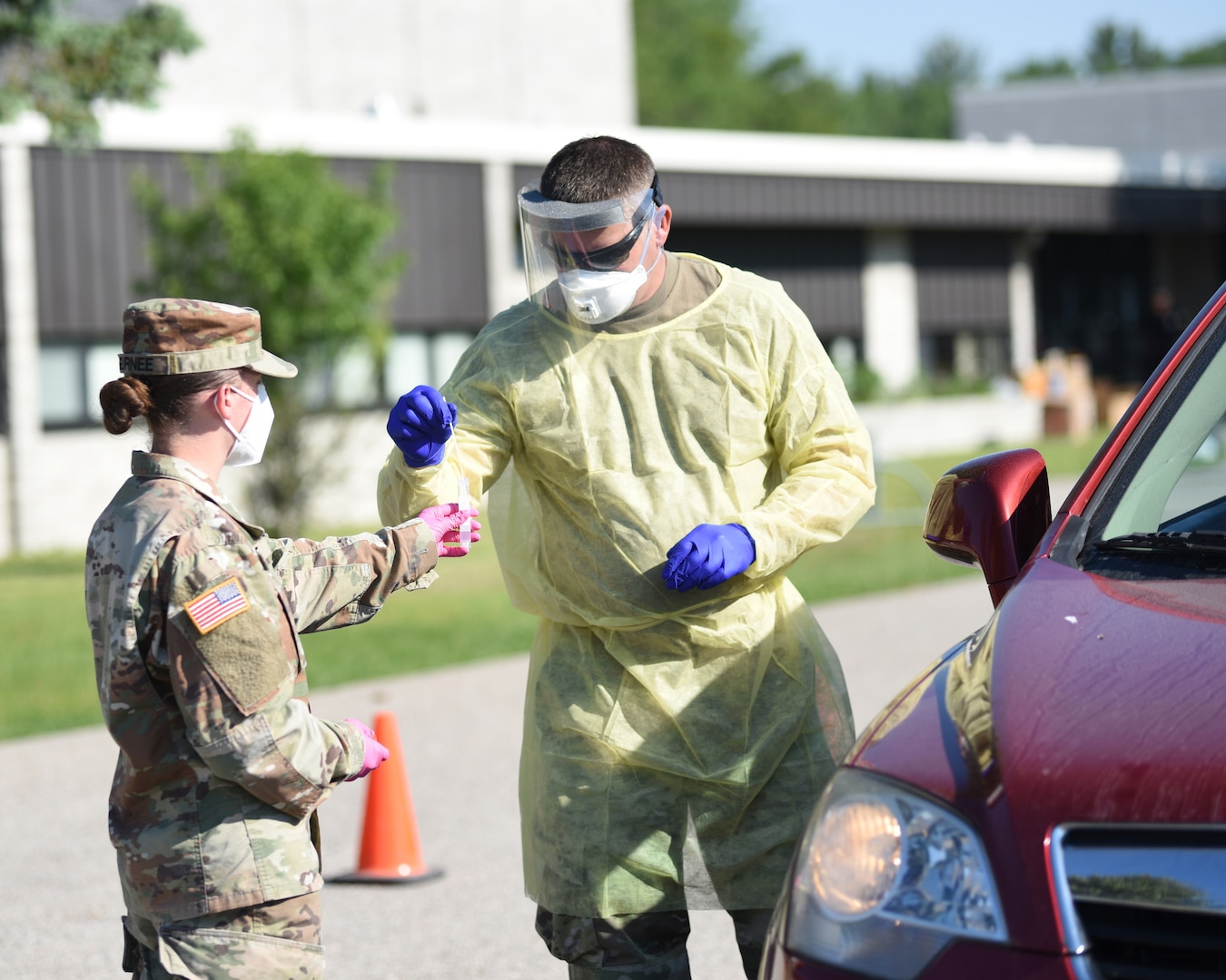 Soldiers from the Michigan Army National Guard conduct free drive-thru COVID-19 testing in Alpena, Michigan, June 19, 2020. The Guard has 20 three-person teams supporting community testing throughout Michigan.