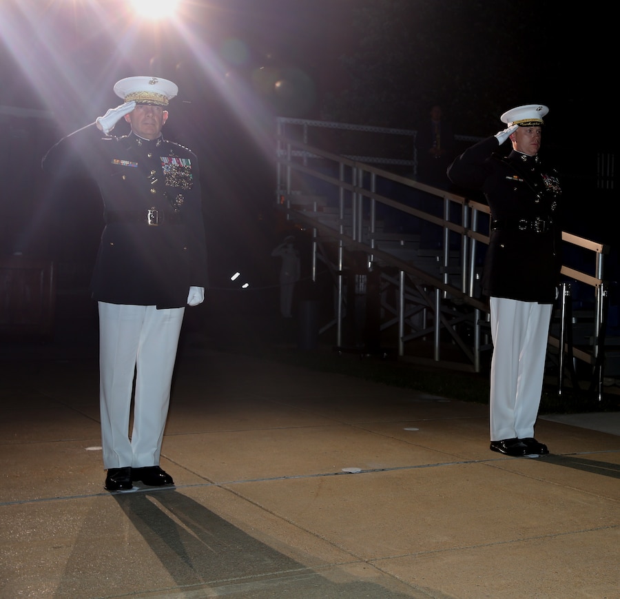 The 38th Commandant of the Marine Corps Gen. David H. Berger and Marine Barracks Washington Commanding Officer Col. Teague A. Pastel salute during the “honors” sequence at the Friday Evening Parade, June 26, 2020. General Berger was the guest of honor for the parade, and Col. Pastel was the hosting official. (U.S. Marine Corps photo by Cpl. James Bourgeois)
