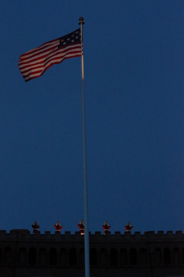 Musicians with “The Commandant’s Own,” United States Marine Drum and Bugle Corps, execute “rampart fanfare” during the Friday Evening Parade at Marine Barracks Washington, D.C., June 26, 2020. “The Commandant’s Own” reduced the number of musicians on the ramparts from nine to five in order to increase physical distancing between the Marines. The hosting official for the evening was Col. Teague A. Pastel,  commanding officer, Marine Barracks Washington, and the 38th Commandant of the Marine Corps, Gen. David H. Berger, was the guest of honor. (U.S. Marine Corps photo by Sgt. Robert Knapp)