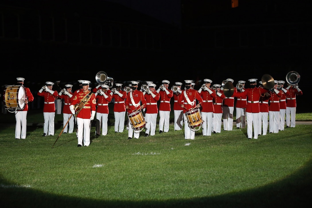 Master Gunnery Sgt. Keith Martinez, drum major, “The Commandant’s Own,” United States Marine Drum and Bugle Corps, leads the Marines during “slow march” at the Friday Evening Parade, June 26, 2020. To maximize safety precautions during this year’s parade season, “The Commandant’s Own” reduced the number of marching musicians from 36 to 25 and spread out their formation to increase physical distancing between the Marines. The hosting official for the evening was Col. Teague A. Pastel, commanding officer, Marine Barracks Washington, and the 38th Commandant of the Marine Corps, Gen. David H. Berger, was the guest of honor. (U.S. Marine Corps photo by Sgt. Robert Knapp)