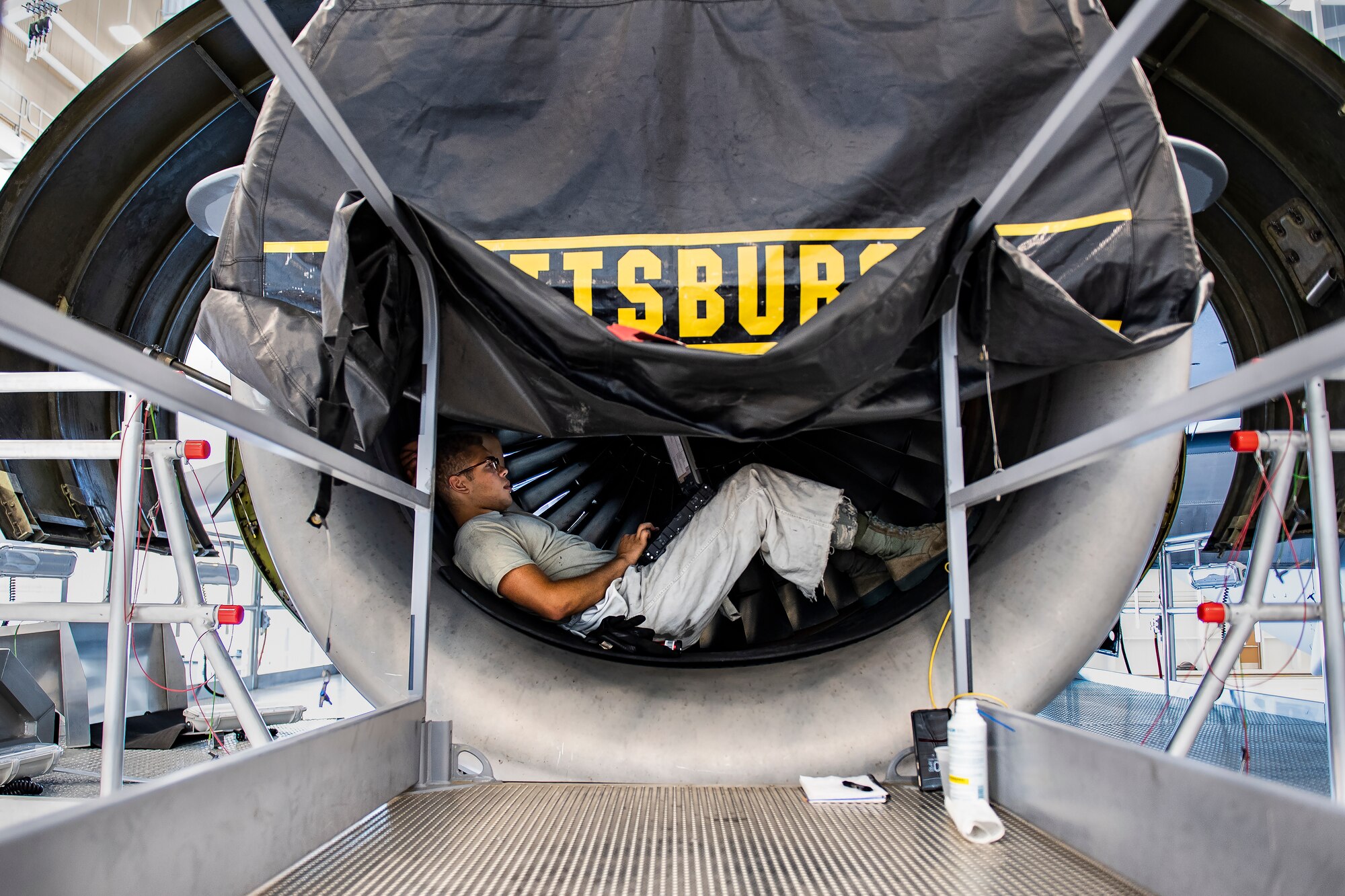 Staff Sgt. Wilfredo Vargas, 911th Maintenance Squadron jet propulsion technician, reads a technical order before performing maintenance on a C-17 Globemaster III engine at the Pittsburgh International Airport Air Reserve Station, Pennsylvania, June 25, 2020.