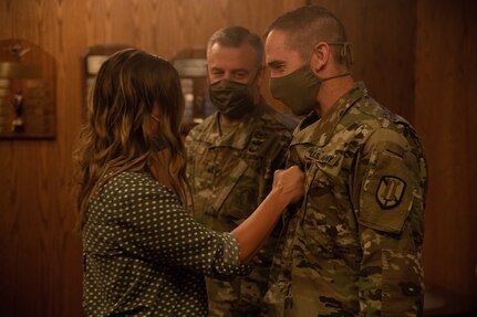 Lt. Col. Woodrow Miner, commander, 204th Maneuver Enhancement Brigade, is promoted to the rank of colonel during a ceremony at Utah National Guard headquarters in Draper, Utah,  June 17, 2020, with a date of rank May 21, 2020.