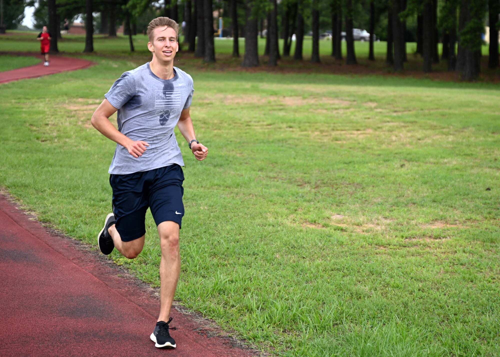 Senior Airman Trenton Sikute, 19th Contracting Squadron contract specialist, runs on the track during a Vital 90 course as part of Wingman Day at Little Rock Air Force Base.