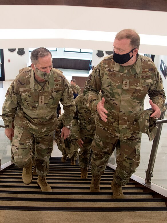 Photo of Air Force Chief of Staff Gen. David L. Goldfein, left, and Chief of Air Force Reserve Lt. Gen. Richard W. Scobee, walking up stairs inside the new headquarters for Air Force Reserve Command, at Robins Air Force Base, Georgia, June 24, 2020.