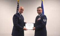U.S. Air Force Lt. Col. John Barrett, 628th Logistics Readiness Squadron commander presents Tech. Sgt. David Hoy, 628th LRS Fuels Control Center NCO in charge, a Bronze Star Medal award for his excellence during a deployment to Afghanistan, June 18, 2020 at Joint Base Charleston, S.C. During his deployment, Hoy traveled to various Afghan bases where he would advise on processes involving jet fuels transport and storage. He was rewarded with the Bronze Star Medal as a result of his commitment to the mission.