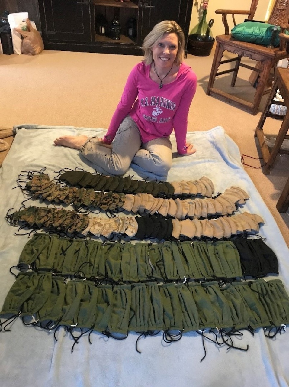 A woman shows off an array of face masks.