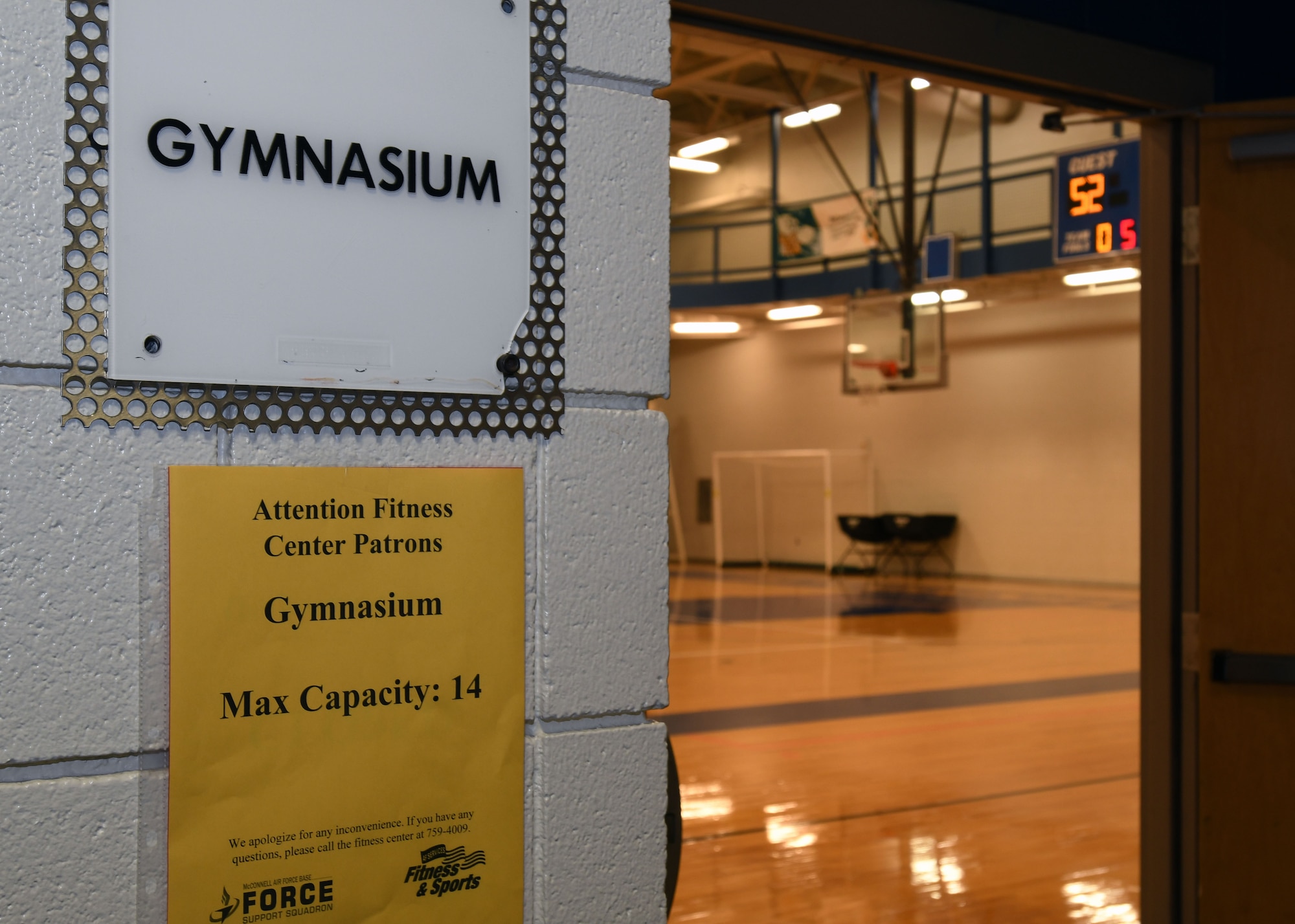 The entry way of the gymnasium bears a new sign which informs customers of the maximum number of occupants authorized inside at a time June 19, 2020, at McConnell Air Force Base, Kansas. The facility opened with limitations while still giving Airmen options to stay fit and safe during the pandemic. (U.S. Air Force photo by Tech. Sgt. Jennifer Stai)
