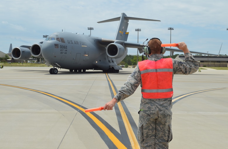 A C-17 Globemaster III aircrew gets ready for a training flight at Pope Field. The aircraft from Joint Base Charleston allowed Pope aircrew to meet training requirements despite COVID-19 restrictions