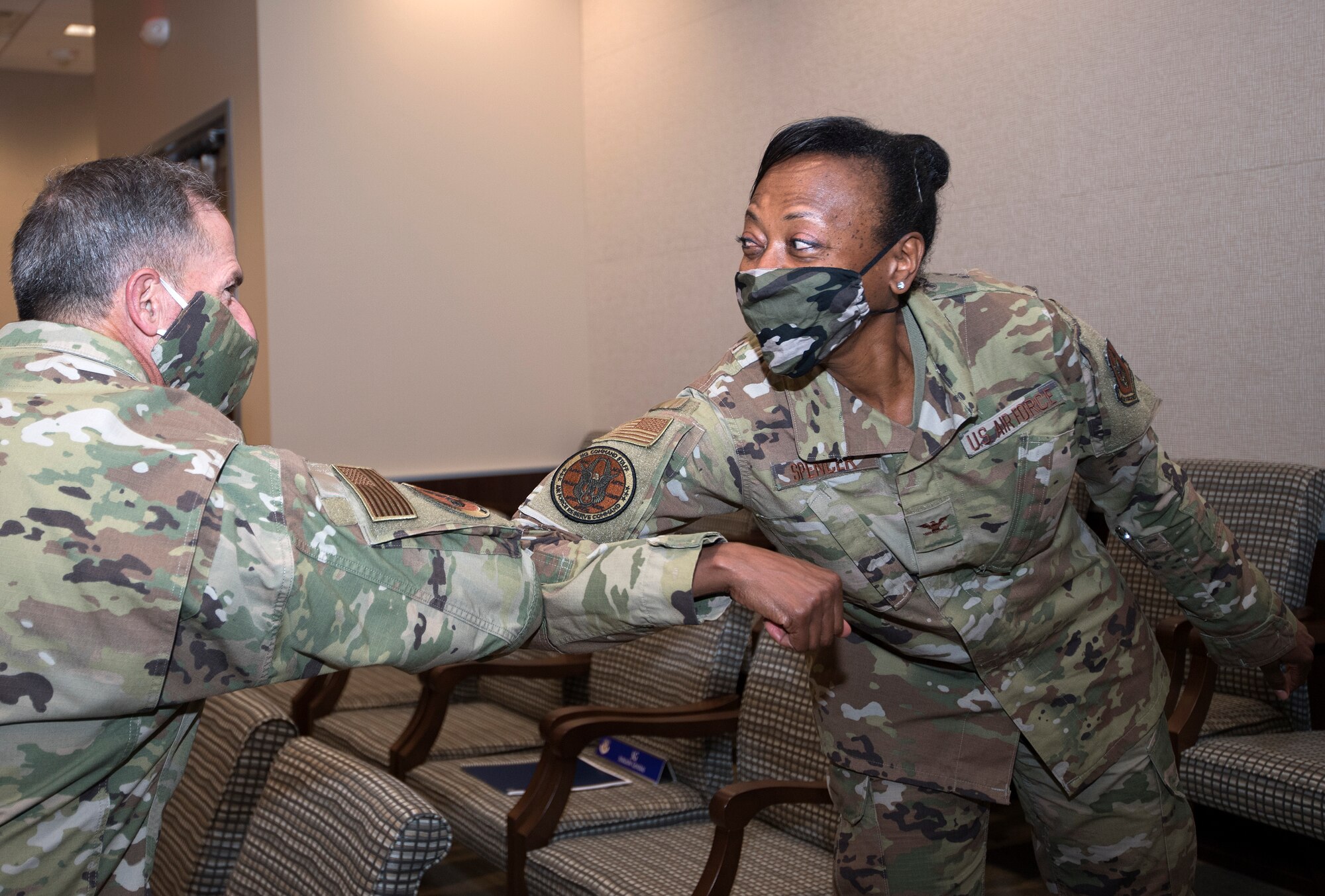Photo of Air Force Chief of Staff Gen. David L. Goldfein, elbow bumping Col. Eltressa Spencer, Commanders Action Group Director for Air Force Reserve Command, as a greeting and a safety measure against COVID-19, at Robins Air Force Base, Georgia, June 24, 2020.