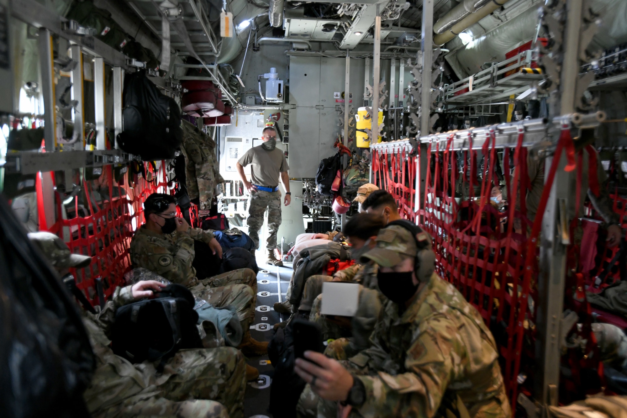 433rd Civil Engineer Squadron firefighters get settled aboard a C-130H Hercules cargo aircraft June 28, 2020 at Joint Base San Antonio-Lackland, Texas.