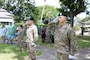 The U.S. Army Corps of Engineers Honolulu District welcomed new leadership today as Lt. Col. Eric S. Marshall (right) assumed command from Lt. Col. Kathryn P. Sanborn (center left) during a modified change of command ceremony at Fort Shafter’s Palm Circle Gazebo.