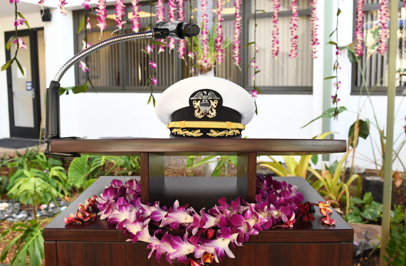 Podium is decorated with Hawaiian leis and uniform cover prior to ceremony.