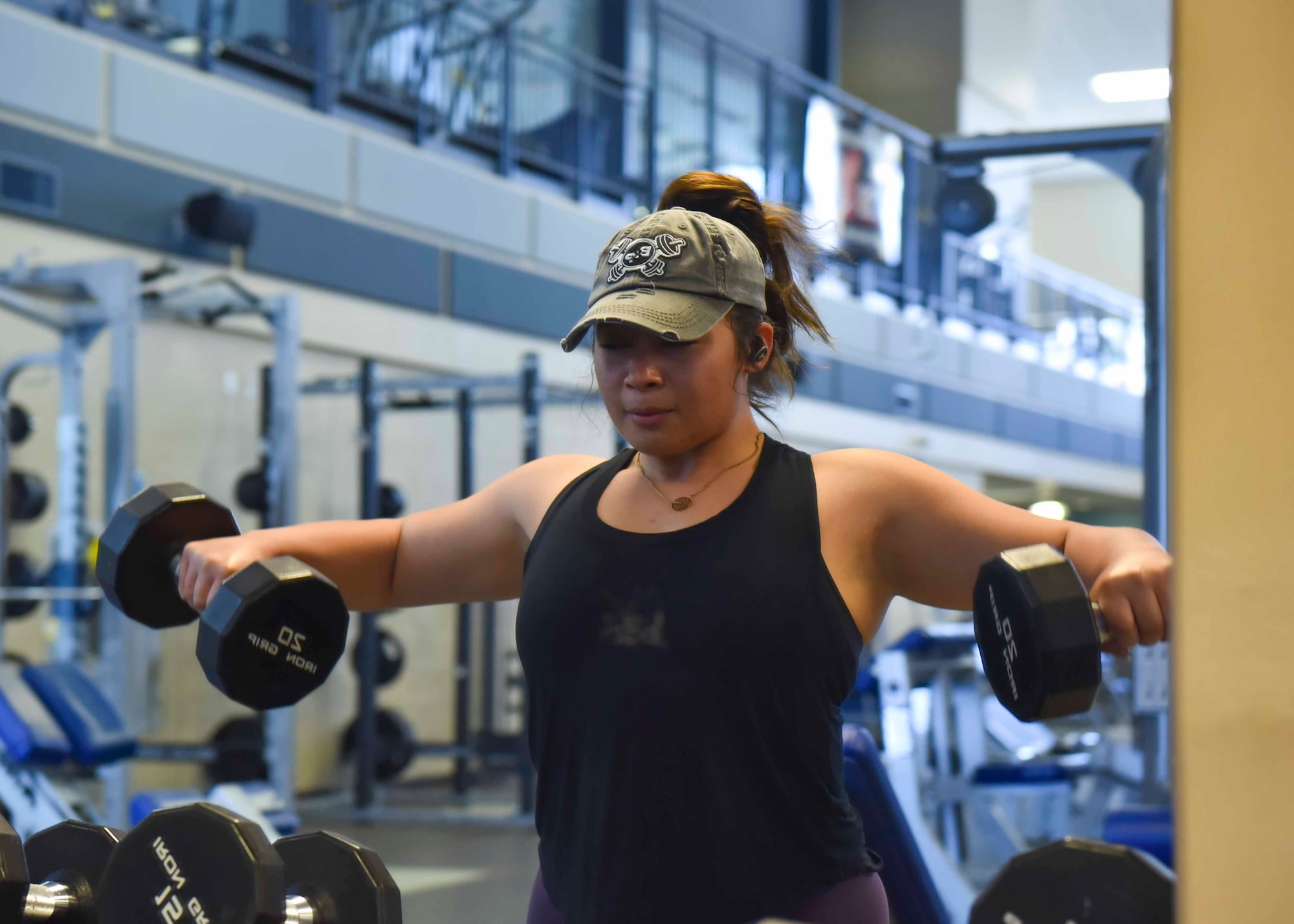 U.S. Air Force Staff Sgt. Samantha Acevedo, 92nd Force Support Squadron fitness assessment cell manager, does a workout in the Fairchild Air Force Base fitness center, June 29, 2020. Physical fitness is important for all Airmen, especially with upcoming physical fitness tests. (U.S. Air Force photo by Airman 1st Class Kiaundra Miller)