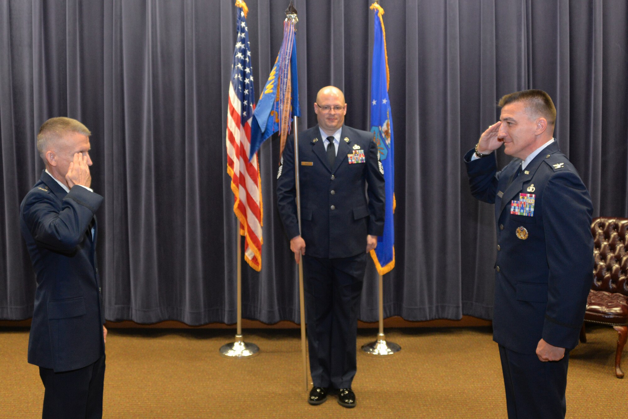 Col. Michael Marsicek, (right), assumes command of the 2nd Weather Group from Col. Brian Pukall (left), 557th Weather Wing commander, during a change of command ceremony at the 557th WW headquarters building, Offutt Air Force Base, Nebraska, June 24, 2020.