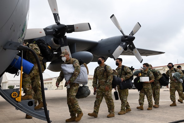 433rd Civil Engineer Squadron firefighters board a C-130H Hercules cargo aircraft June 28, 2020 at Joint Base San Antonio-Lackland, Texas.