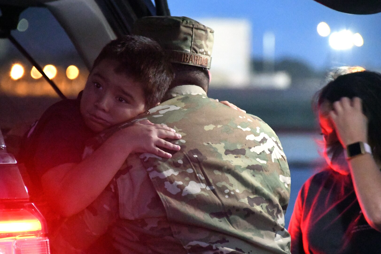Tech. Sgt. Charles Lambardia, 433rd Civil Engineer Squadron firefighter, hugs his son, Liam, as he prepares to leave for a deployment June 28, 2020, at Joint Base San Antonio-Lackland, Texas.