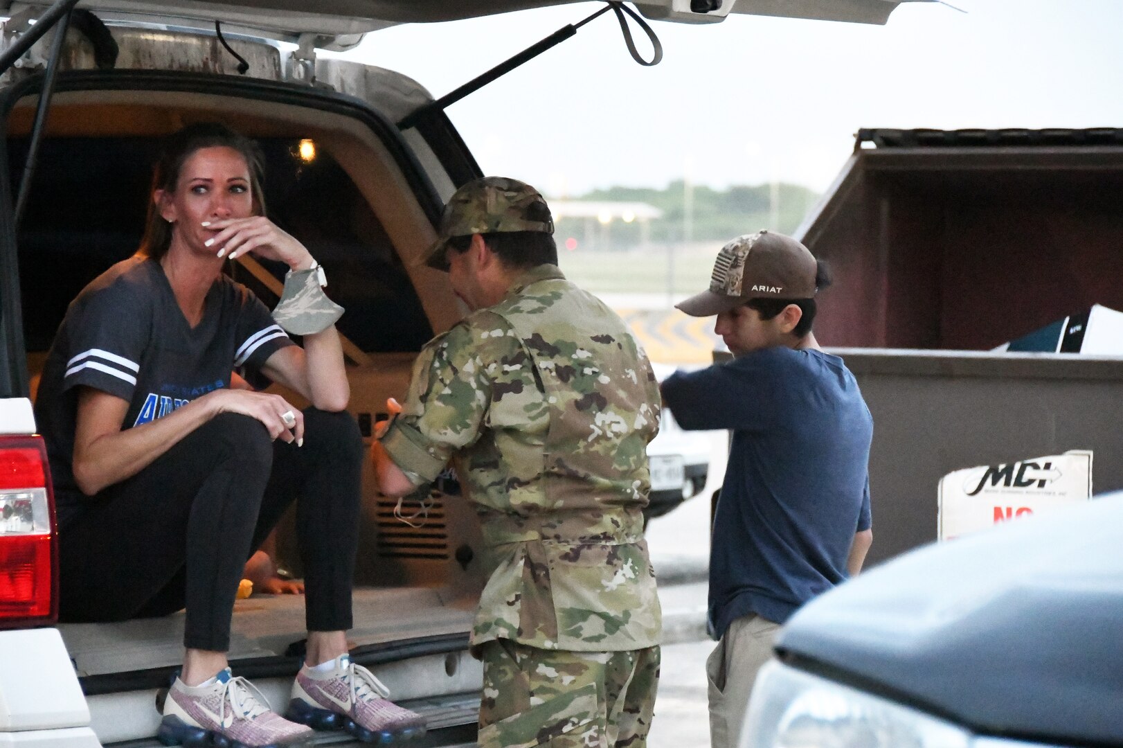 Tech. Sgt. Brian Ynclan, 433rd Civil Engineer Squadron firefighter, spends a few moments with his family before leaving for a deployment June 28, 2020, at Joint Base San Antonio-Lackland, Texas.