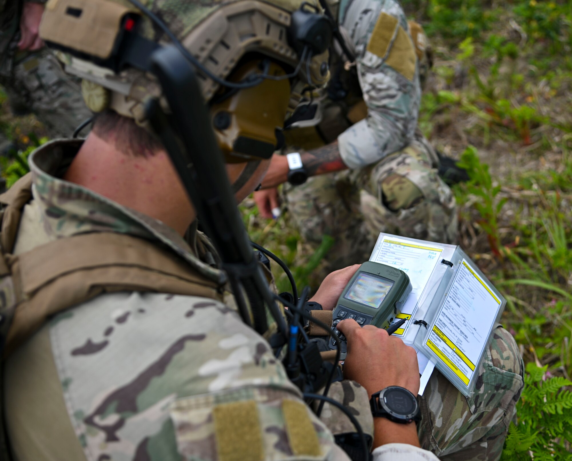 A U.S. Air Force joint terminal attack controller assigned to the 320th Special Tactics Squadron fills in information for a 9-line at Draughon Range, near Misawa Air Base, Japan, June 15, 2020. A 9-line is a standardized format in which a JTAC gives targeting information to aircraft pilots. Brandt and other JTACS from the 320th STS came to Draughon Range to maintain their currency as combat controllers. (U.S. Air Force photo by Tech. Sgt. Timothy Moore)