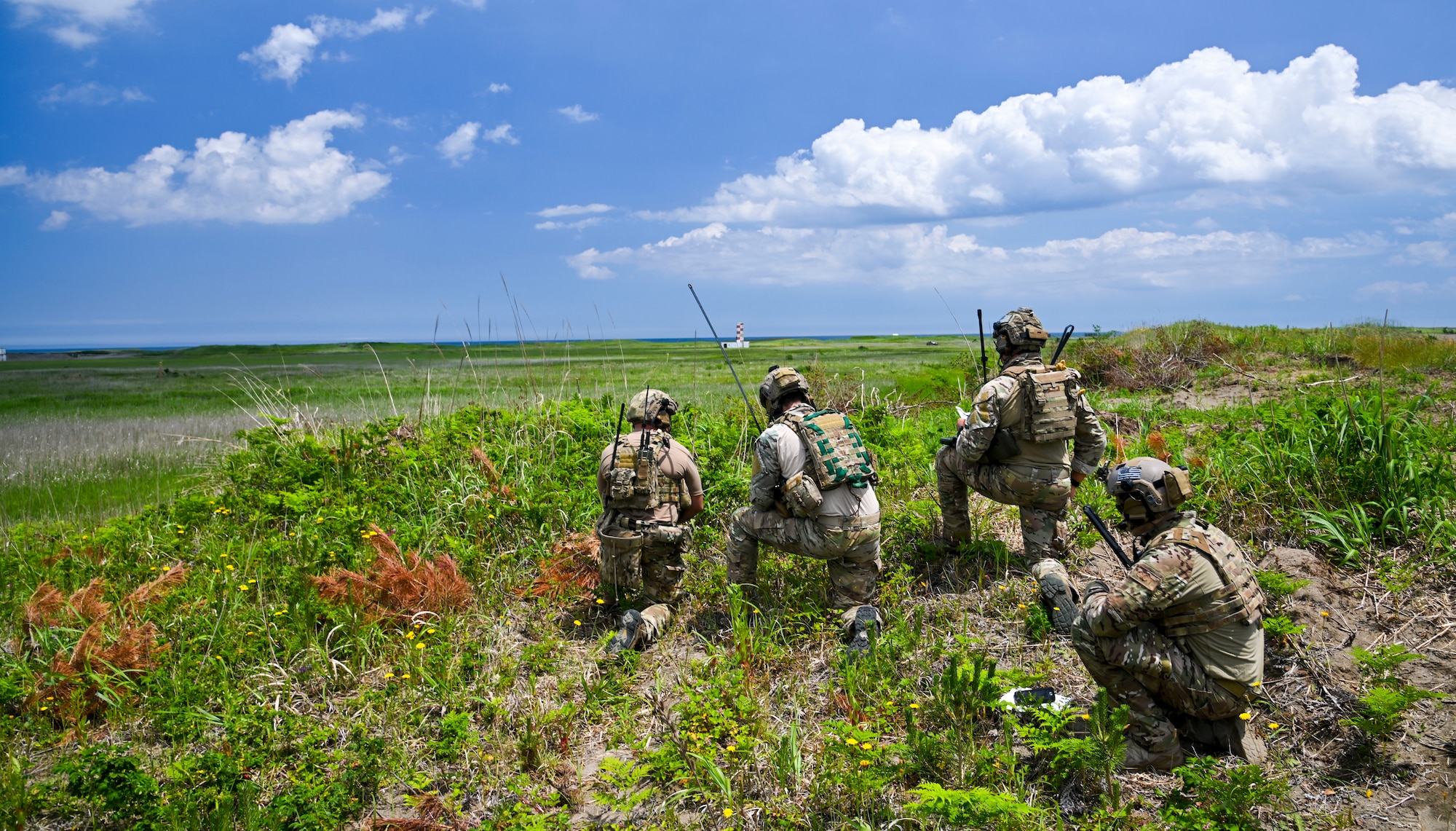 U.S. Air Force joint terminal attack controllers assigned to the 320th Special Tactics Squadron look out over the terrain during a close air support at Draughon Range, near Misawa Air Base, Japan, June 15, 2020. Defined as air action by fixed- and rotary-winged aircraft against hostile targets that are in close proximity to friendly ground forces, CAS requires coordination between ground forces and aircraft which can be guided onto target by JTACs. (U.S. Air Force photo by Tech. Sgt. Timothy Moore)