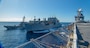 USNS Medgar Evers (T-AKE-13) refuels the Wasp-class amphibious assault ship USS Iwo Jima (LHD 7) to her port side and USS Winston S. Churchill (DDG 81) to her starboard side during a replenishment-at-sea, February 23, 2020