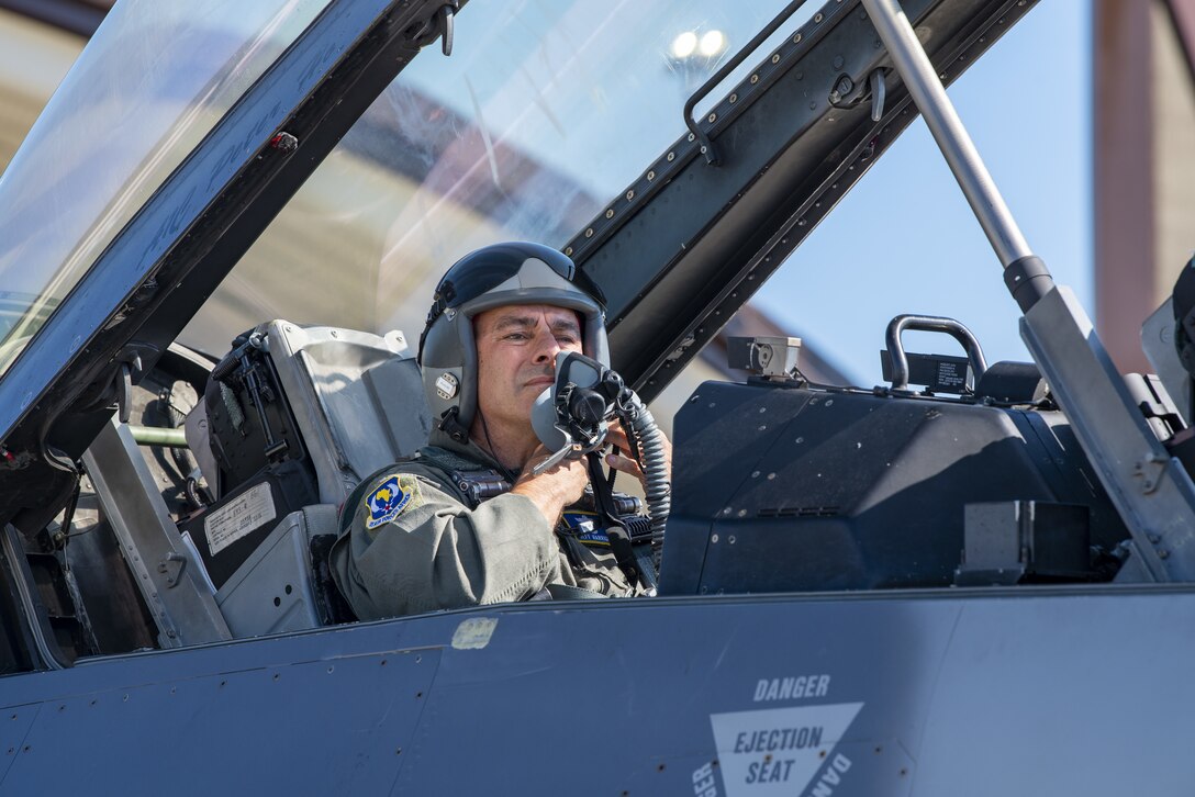 Gen. Jeff Harrigian, U.S. Air Forces in Europe and Air Forces Africa commander, dons his helmet before take-off during an Agile Combat Employment exercise on the flight line at Spangdahlem Air Base, Germany, June 25, 2020. USAFE-AFAFRICA continuously exercises ways to improve the U.S. passive and active defense capabilities that ensure the U.S. advantage in resiliency and protect our assets and personnel. (U.S. Air Force photo by Senior Airman Branden Rae)