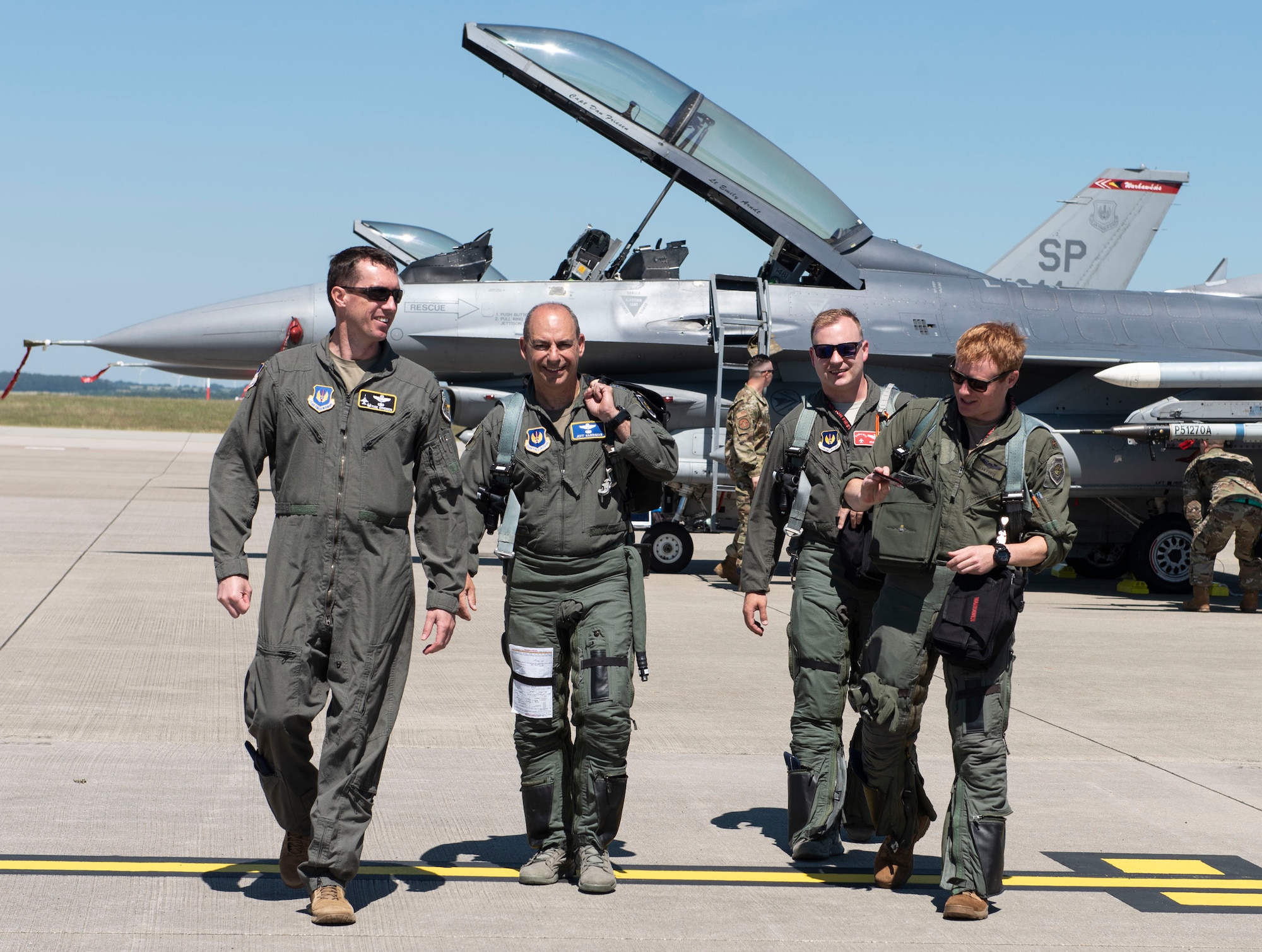 Lt. Col. David Epperson, from left, 52nd Fighter Wing commander, Gen. Jeff Harrigian, U.S. Air Forces in Europe and Air Forces Africa commander, Capt. Daniel Cook, 480th Fighter Squadron pilot, and Maj. Sean Foote, 480th FS pilot, walk towards the Agile Combat Employment exercise setup at Spangdahlem Air Base, Germany, June 26, 2020. Exercising elements of ACE enables USAFE-AFAFRICA to operate from locations with varying levels of capacity and support, ensuring Airmen and aircrews are postured to deliver lethal combat power across the spectrum of military operations. (U.S. Air Force photo by Senior Airman Melody W. Howley)