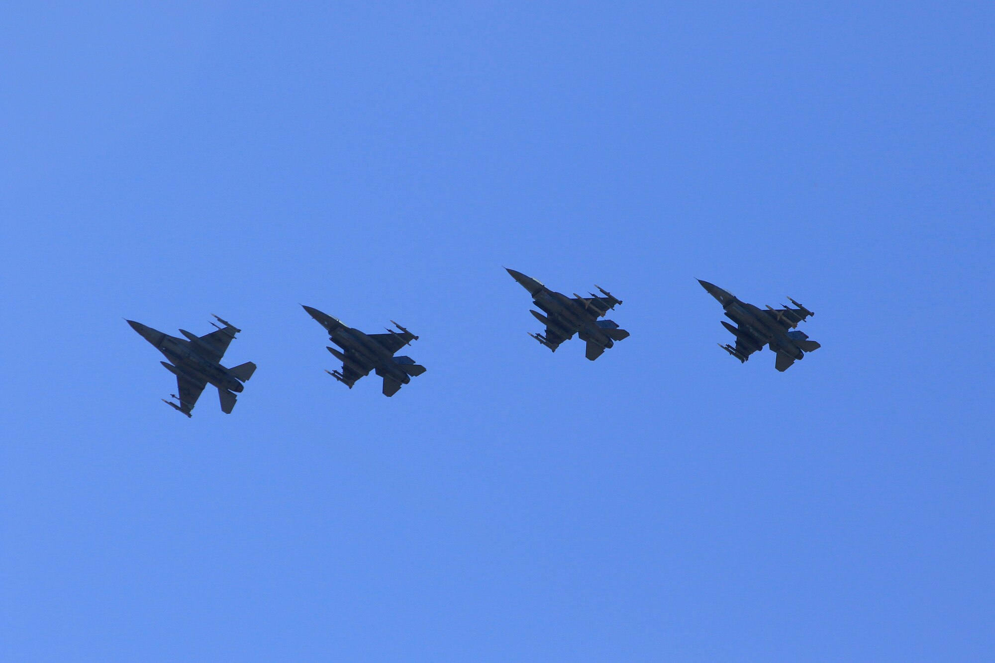 U.S. Air Force F-16 Fighting Falcons assigned to the 52nd Fighter Wing at Spangdahlem Air Base, Germany, fly in a formation during an Agile Combat Employment exercise over Büchel Air Base, Germany, June 25, 2020. Pilots from the 480th Fighter Squadron landed the F-16s at Büchel AB, where NATO partners aided in the exercise by refueling their jets. (Photo courtesy of Büchel Air Base Public Affairs)
