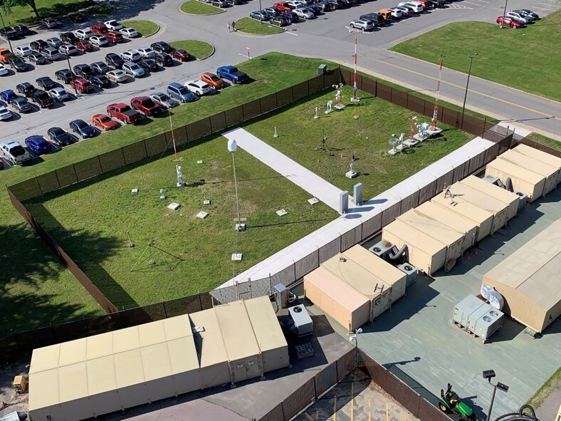 An aerial view of fixed based weather systems and a portable Doppler radar system at the Weather Engineering Facility at Hanscom Air Force Base, Mass. A team at Hanscom recently worked innovatively with the 46th Test Squadron, Eglin AFB, Fla., to become “remote hands” using the WEF to ensure testing necessary to keep fixed based weather systems operational would continue, despite the ongoing global pandemic. (U.S. Air Force photo by Steve O’Neil)