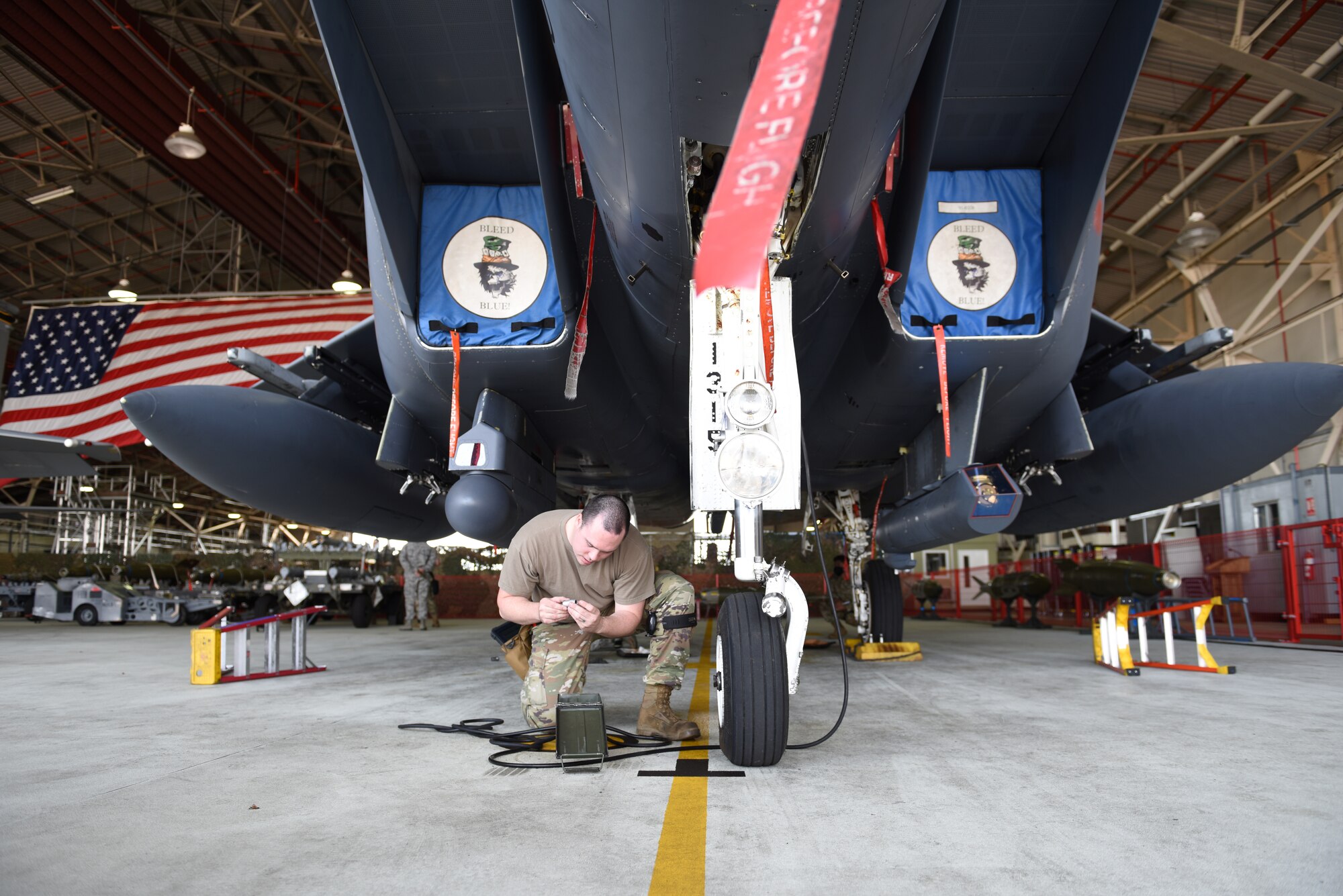A Liberty Wing Airman assigned to the 492nd Fighter Squadron Aircraft Maintenance Unit inspects an F-15E Strike Eagle at Royal Air Force Lakenheath, England, June 26, 2020. Load crew competitions help Airmen test their speed and accuracy while focusing on safety and efficiency in a controlled environment. (U.S. Air Force photo by Airman 1st Class Rhonda Smith)