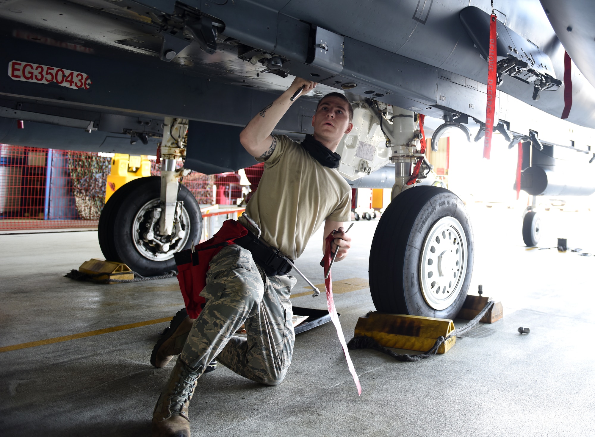 A Liberty Wing Airman assigned to the 492nd Fighter Squadron Aircraft Maintenance Unit prepares to load munitions on an F-15E Strike Eagle at Royal Air Force Lakenheath, England, June 26, 2020. Load crew competitions help Airmen test their speed and accuracy while focusing on safety and efficiency in a controlled environment. (U.S. Air Force photo by Airman 1st Class Rhonda Smith)