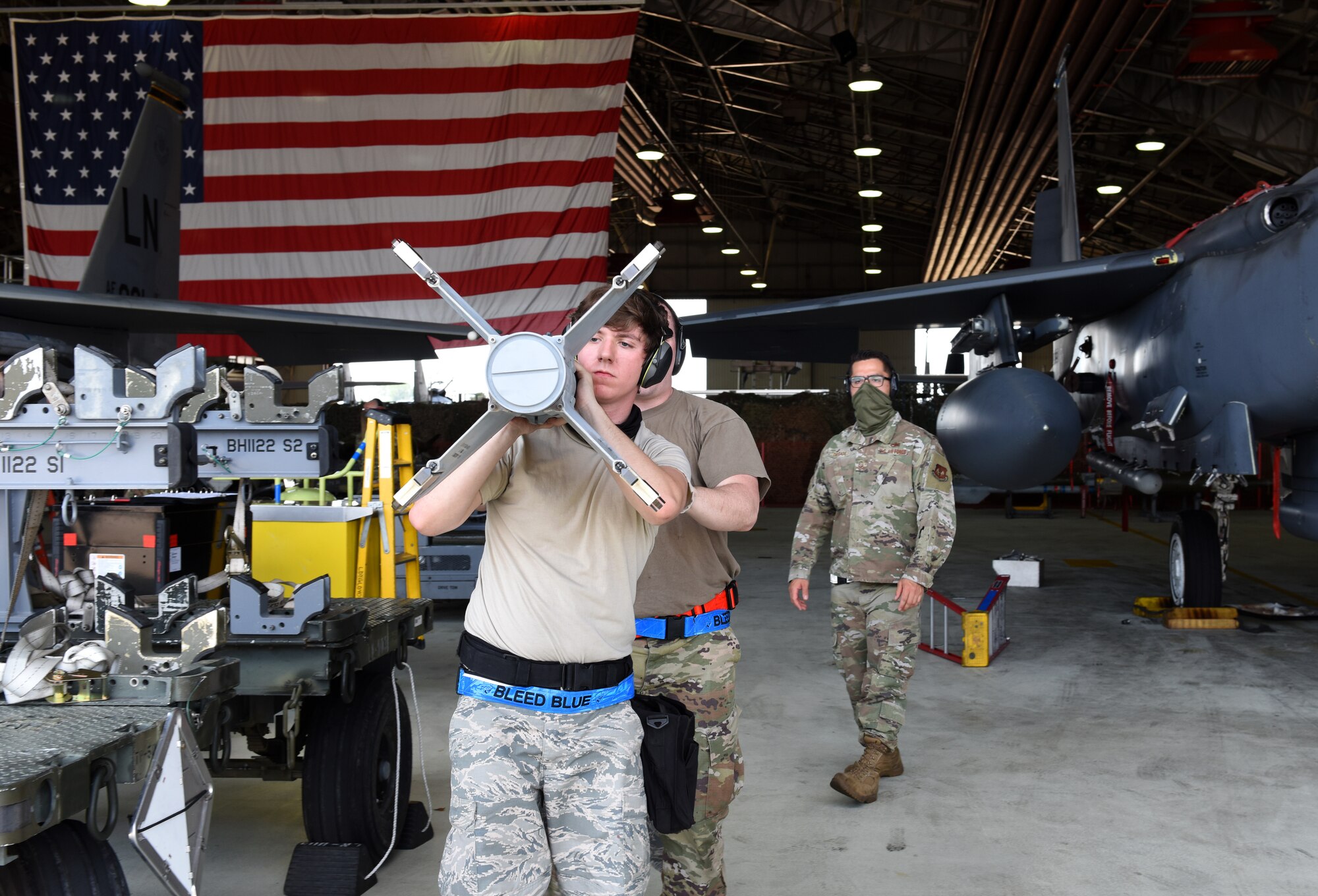 A Liberty Wing Airman assigned to the 492nd Fighter Squadron Aircraft Maintenance Unit prepares to load munitions during a quarterly load crew competition at Royal Air Force Lakenheath, England, June 26, 2020. The quarterly event encourages team building skills while testing weapon loading capabilities and proficiency. (U.S. Air Force photo by Airman 1st Class Rhonda Smith)