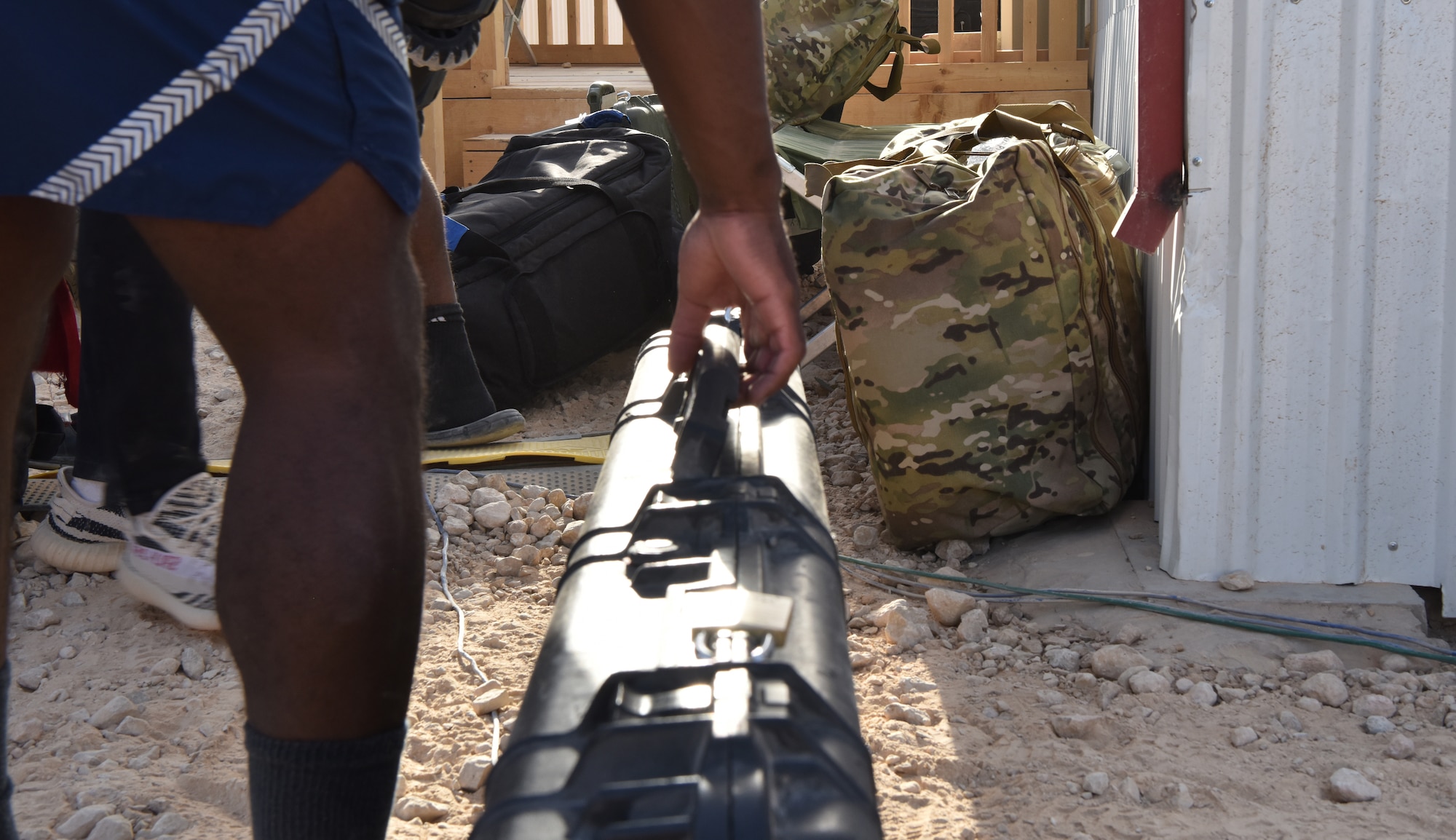 The 378th Expeditionary Logistics Readiness Squadron moves bags at Prince Sultan Air  Base, Kingdom of Saudi Arabia, June 28, 2020.