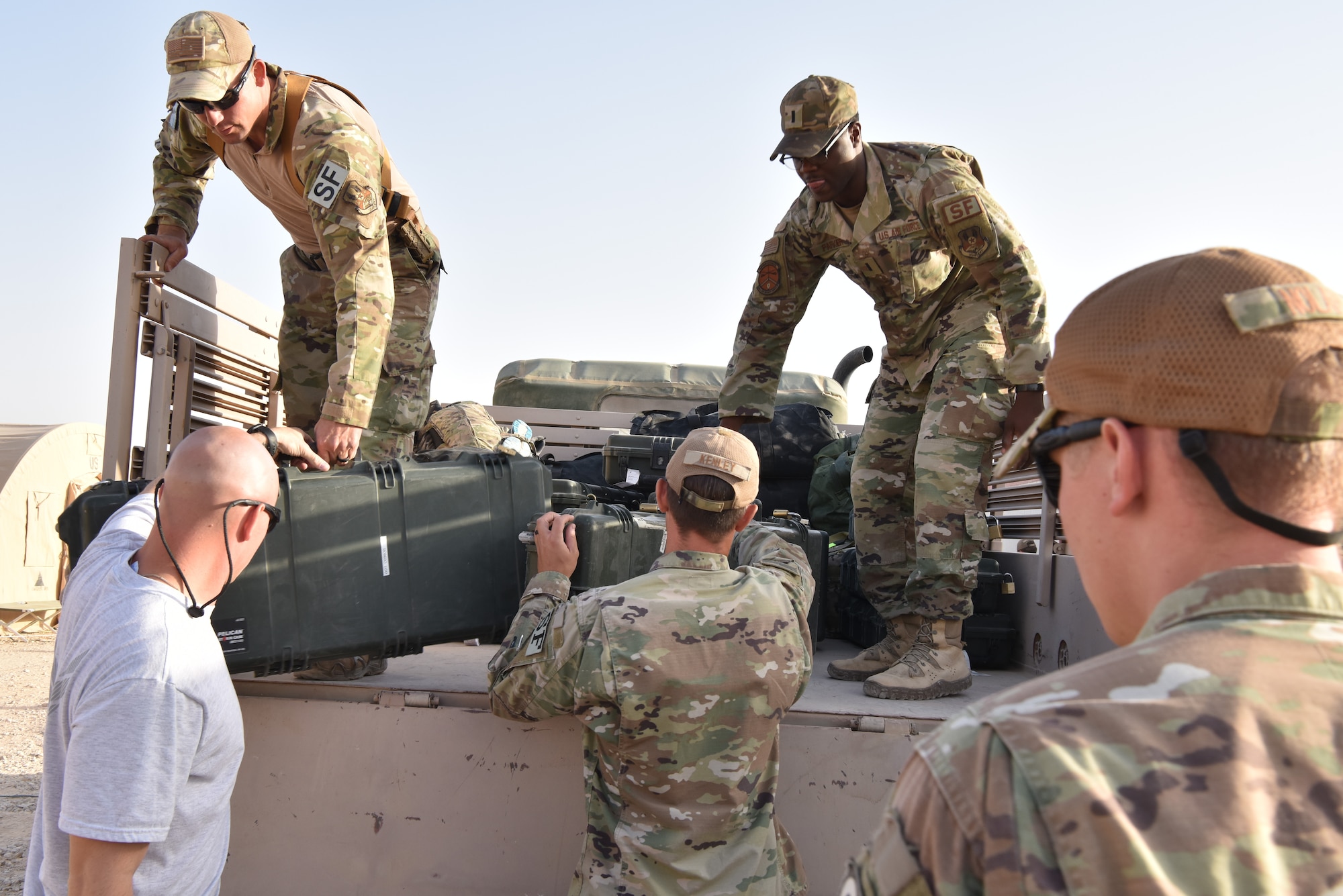 The 378th Expeditionary Logistics Readiness Squadron moves bags at Prince Sultan Air  Base, Kingdom of Saudi Arabia, June 28, 2020.