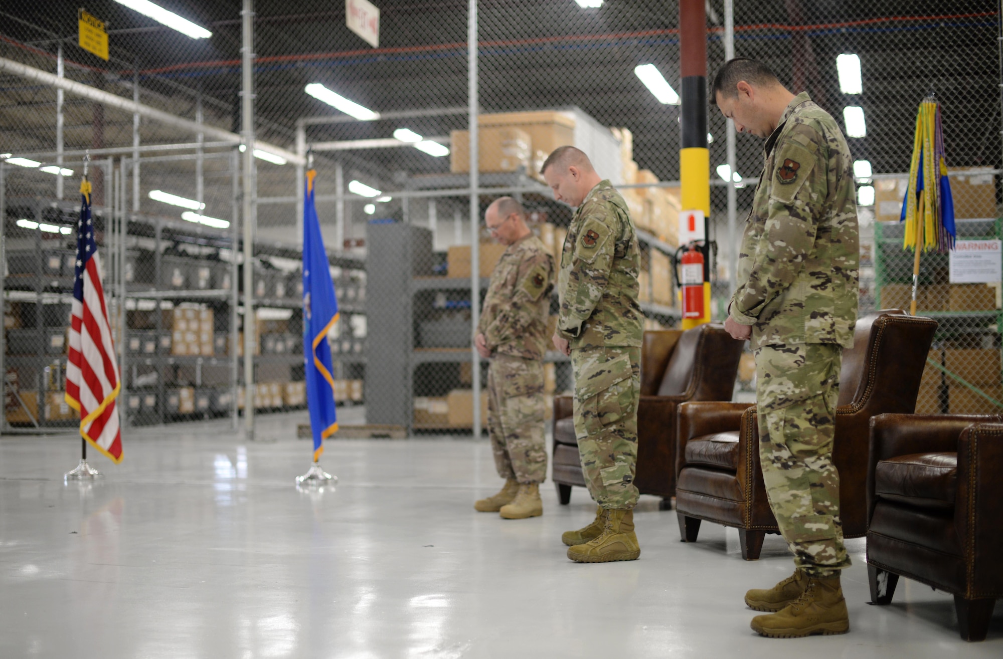 Col. Gary Hayward, 14th Mission Support Group Commander, Dennis Widner, the outgoing 14th Logistics Readiness Squadron commander, and Lt. Col. Michael Kennedy, incoming 14th Logistics Readiness commander, pray June 26, 2020, during the 14th LRS Change of Command Ceremony on Columbus Air Force Base, Miss. The 14th Mission Support Group Logistics Readiness Squadron provides effective logistics support for the wing's flying training mission. (U.S. Air Force photo by Senior Airman Keith Holcomb)