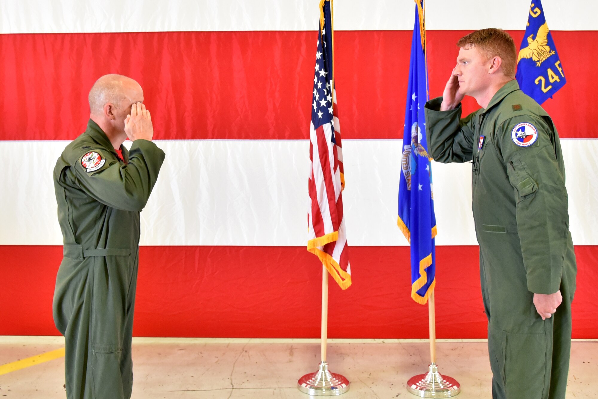 Maj. Ryan “Rojo” Busbey (right) takes command of the 24th Fighter Squadron as he salutes Col. Joshua Padgett, 301st Fighter Wing Operations Group commander, June 26, 2020, at Naval Air Station Joint Reserve Base Fort Worth, Texas. The Assumption of Command ceremony is a military tradition that allows members to witness the formal exchange of command between leaders. (U.S. Air Force photo by Staff Sgt. Randall Moose)