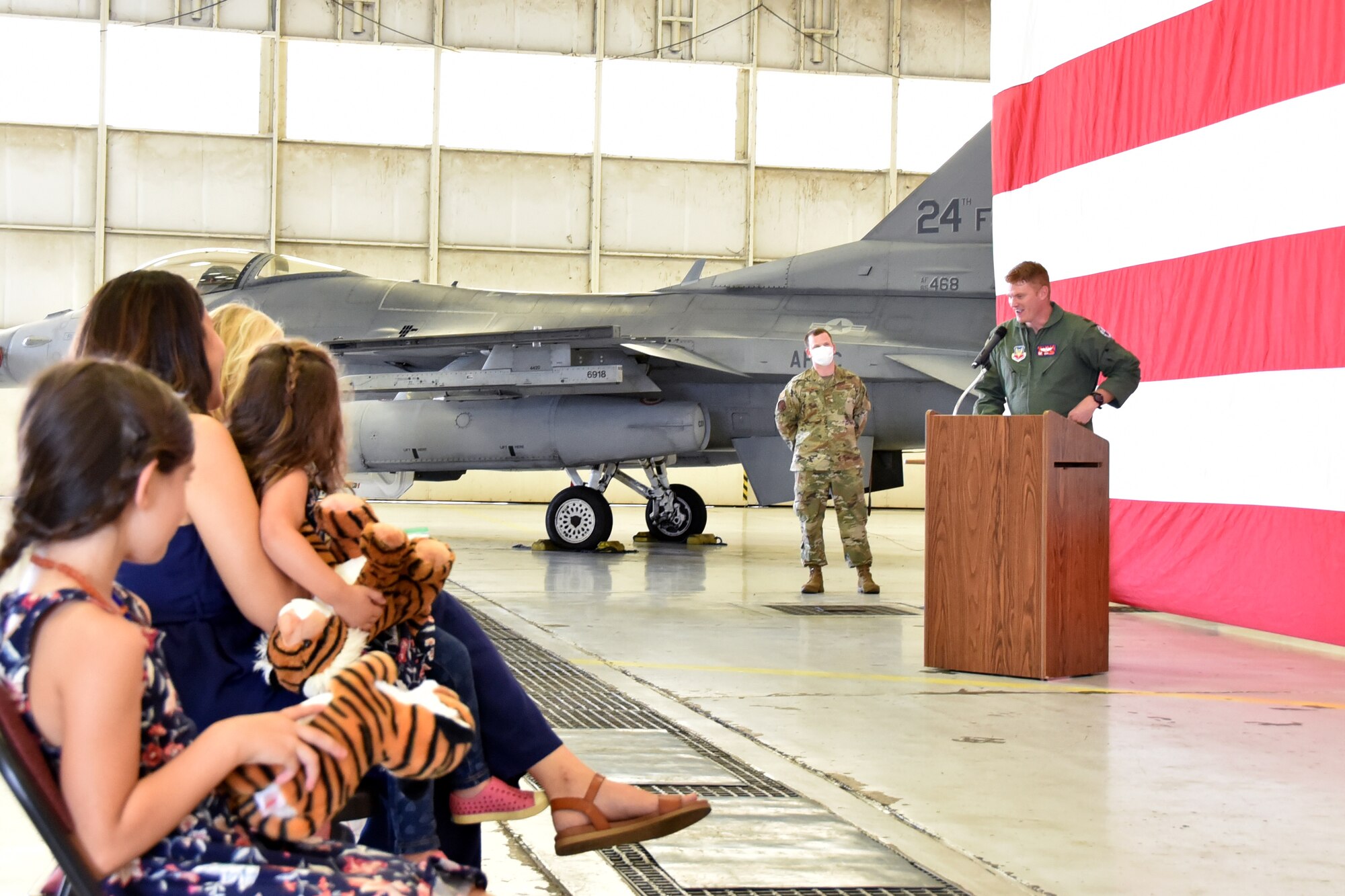 Maj. Ryan “Rojo” Busbey, 24th Fighter Squadron commander, addresses his Airmen and family during the 24th FS assumption of command ceremony, June 26, 2020, at Naval Air Station Joint Reserve Base Fort Worth, Texas. Busbey thanked his co-workers, friends, and family for their support. (U.S. Air Force photo by Staff Sgt. Randall Moose)
