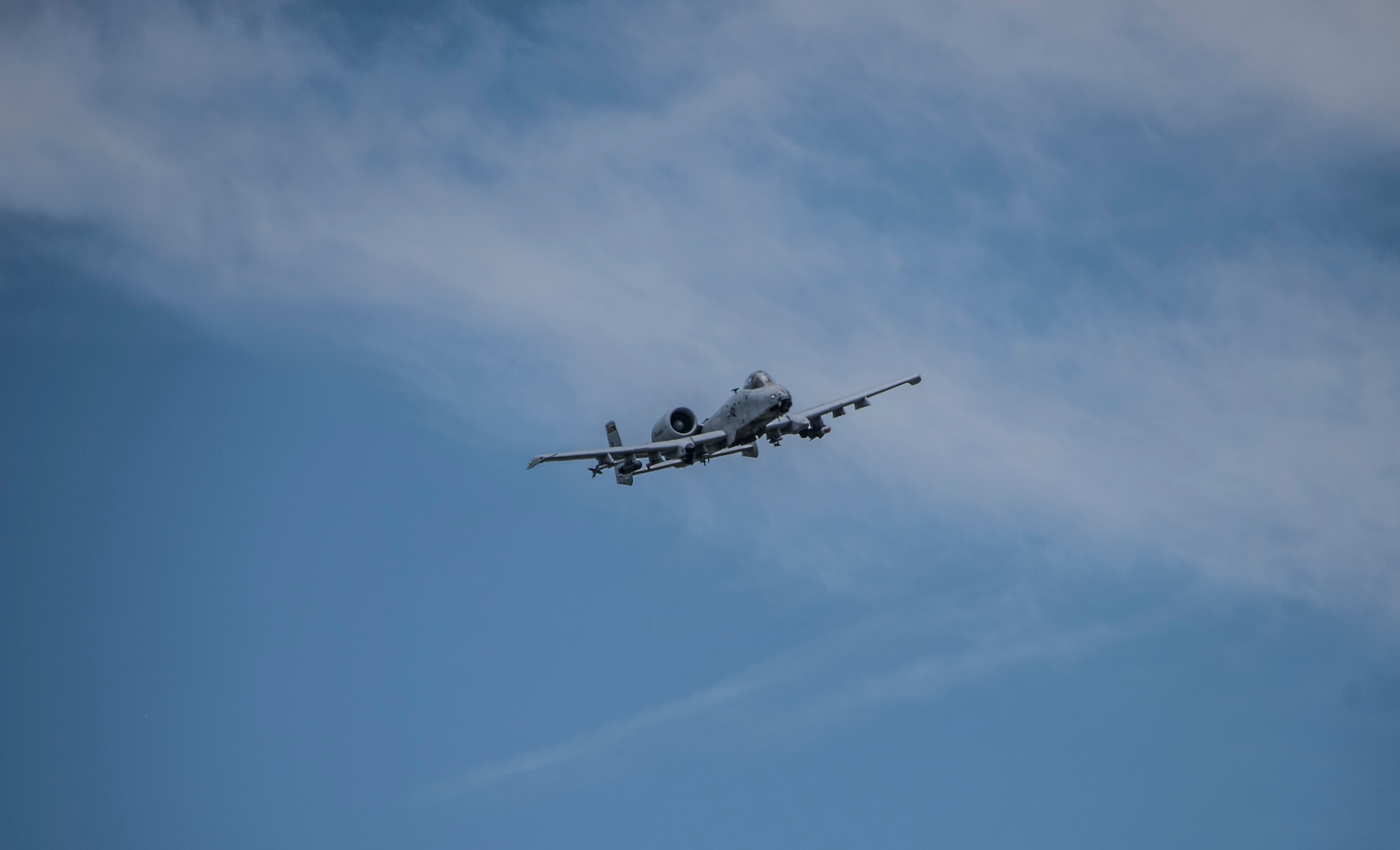 An A-10C Thunderbolt II fighter jet from the 122nd Fighter Wing, Fort Wayne, Indiana flies during a combat search and rescue training exercise in Miami County on June 18, 2020. The mock scenario utilized a UH-60 Black Hawk helicopter from the Gary Army Aviation Support Facility and multiple A-10C Thunderbolt II fighter jets to prepare guardsmen for the safe retrieval of personnel from a downed aircraft inside hostile territory. (U.S. Air National Guard photo by Staff Sgt. Justin Andras)