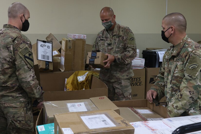 Soldiers with Task Force Spartan work to keep mail operations open while deployed overseas in Kuwait. During Covid-19 with little for soldiers to look forward to mail helps to keep moral up. (U.S. Army Photo by Sgt. Andrew Winchell)