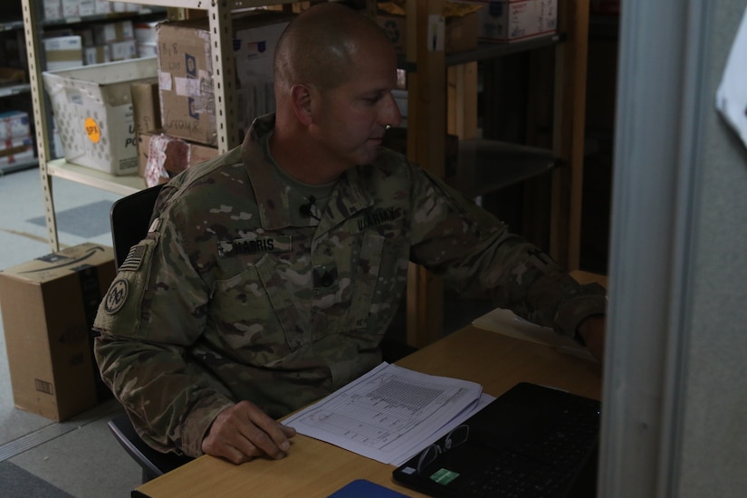 Soldiers with Task Force Spartan work to keep mail operations open while deployed overseas in Kuwait. During Covid-19 with little for soldiers to look forward to mail helps to keep moral up. (U.S. Army Photo by Sgt. Andrew Winchell)
