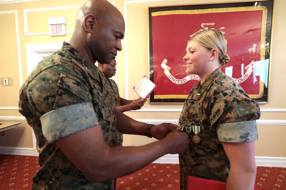 For a young man who grew up in Dayton, Ohio, and enlisted in the Marine Corps, he never imagined his path would end 33 years later as the commanding officer of Marine Corps Logistics Base Albany. In this photo, Col. Trimble is pinning an award on the former Base Adjutant, 1Lt. Delaney Bourlakov.