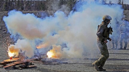 Alaska Air National Guardsmen assigned to the 212th Rescue Squadron maneuver after placing AN-M14 TH3 incendiary hand grenades at the Small Arms Complex on Joint Base Elmendorf-Richardson, Apr. 29, 2020. This type of grenade is exclusively used to destroy equipment. It can damage, immobilize, or destroy vehicles, weapons systems, shelters, or munitions. (U.S. Army National Guard photo by Sgt. Seth LaCount/Released)