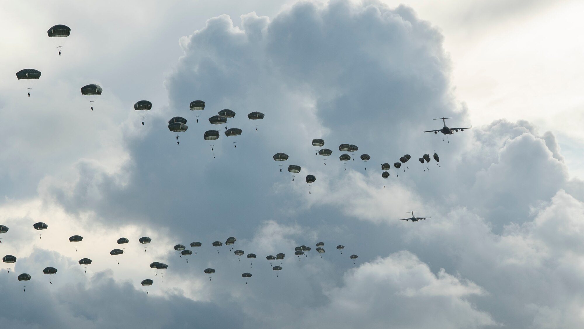 Paratroopers assigned to the 4th Infantry Brigade Combat Team (Airborne), 25th Infantry Division, U.S. Army Alaska, conduct a Joint Forcible Entry Operation (JFEO) jump into Andersen Air Force Base, Guam, June 30.