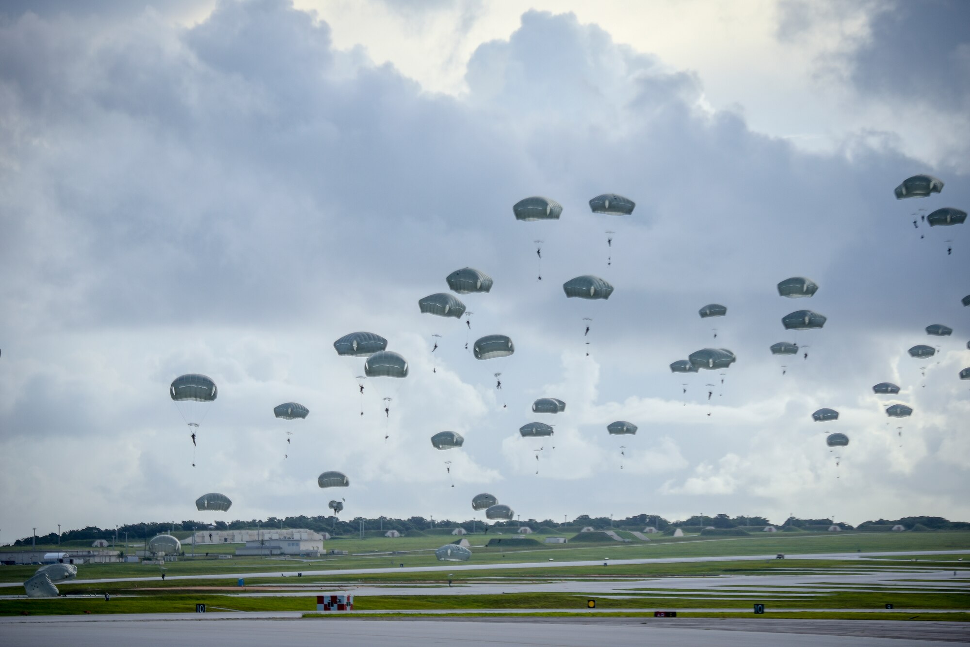 Paratroopers assigned to the 4th Infantry Brigade Combat Team (Airborne), 25th Infantry Division, U.S. Army Alaska, conduct a Joint Forcible Entry Operation (JFEO) jump into Andersen Air Force Base, Guam, June 30.