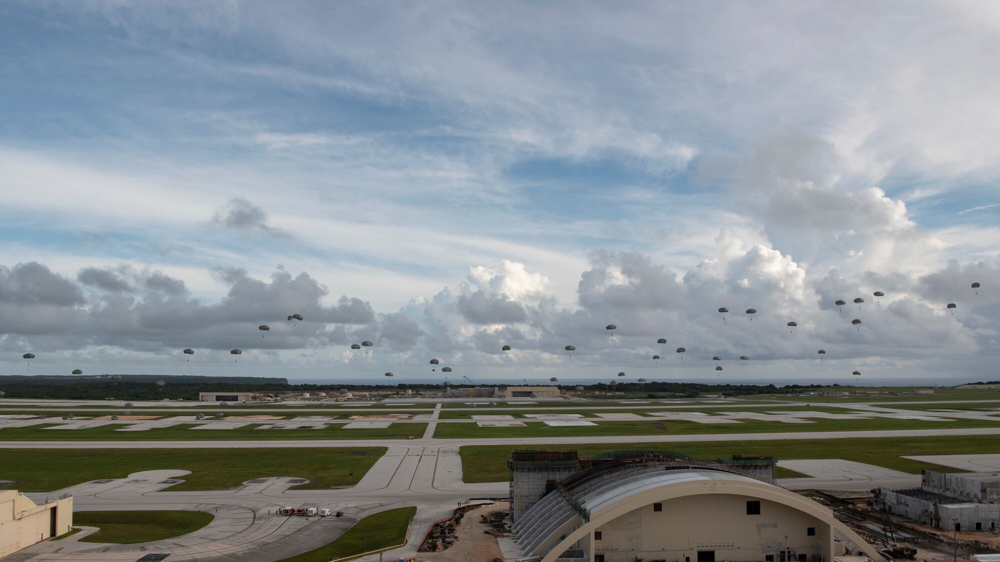 Paratroopers assigned to the 4th Infantry Brigade Combat Team (Airborne), 25th Infantry Division, U.S. Army Alaska, conduct a Joint Forcible Entry Operation (JFEO) jump into Andersen Air Force Base, Guam, June 30.