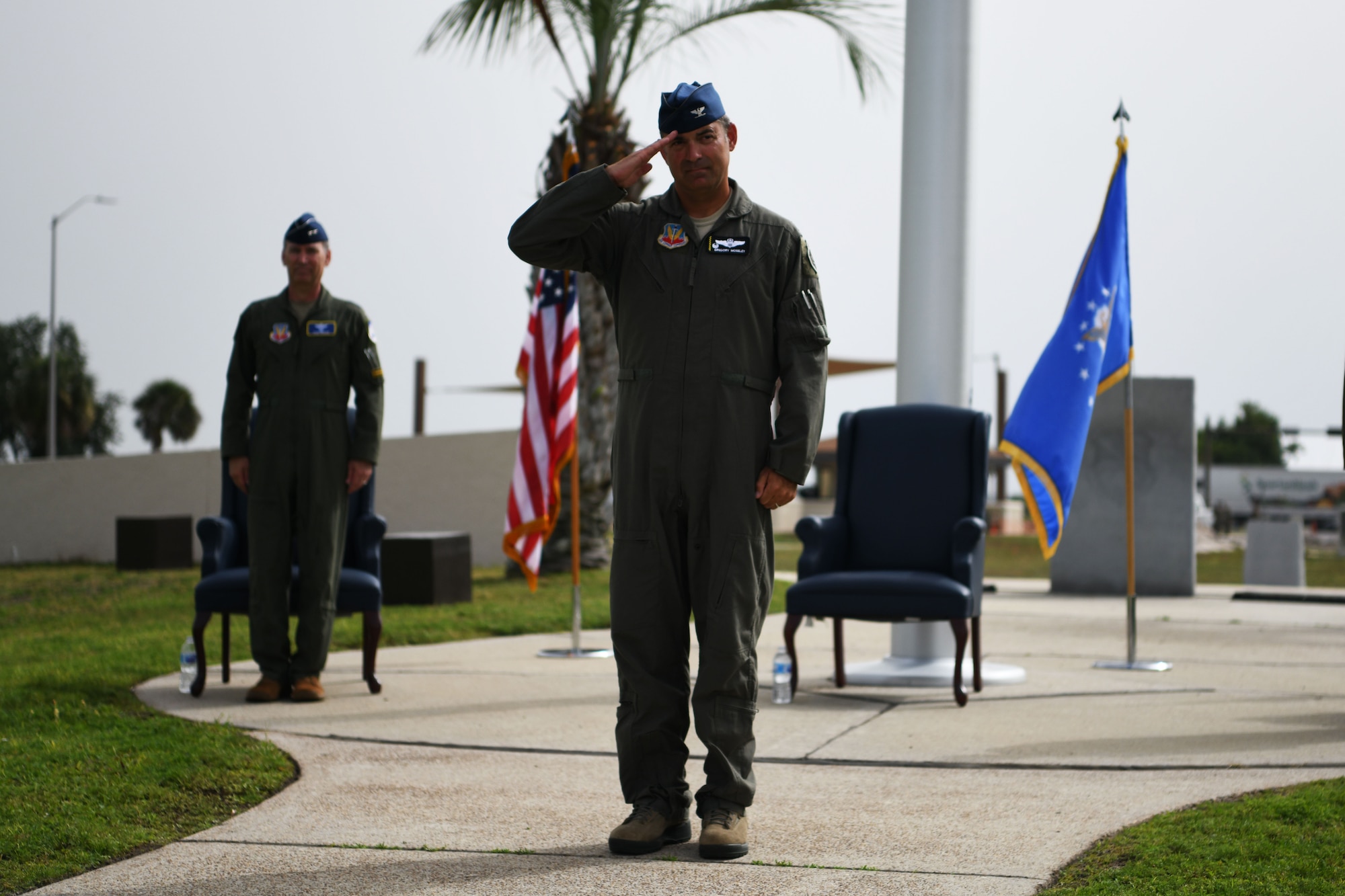 U.S. Air Force Col. Greg Moseley, 325th Fighter Wing commander, receives his first salute from the wing during a change of command ceremony at Tyndall Air Force Base, Florida, June 26, 2020. As the 325th FW commander, Moseley will oversee F-22 Raptor pilot training as well as the continued rebuild of the base following the damage done by Hurricane Michael in 2018. (U.S. Air Force photo by Tech. Sgt. Clayton Lenhardt)